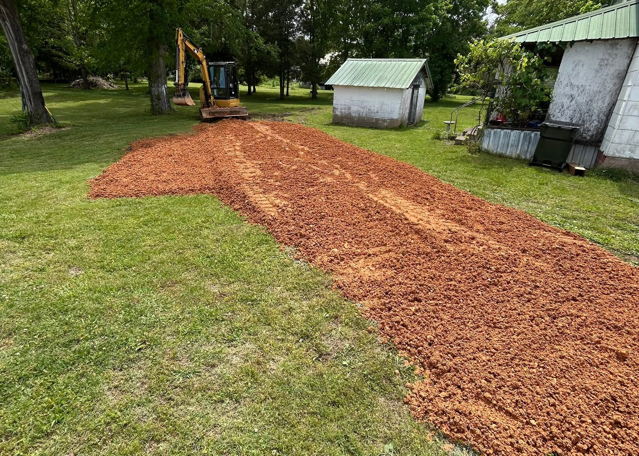 Morris Land Management excavator preparing a gravel pad on a West Tennessee property