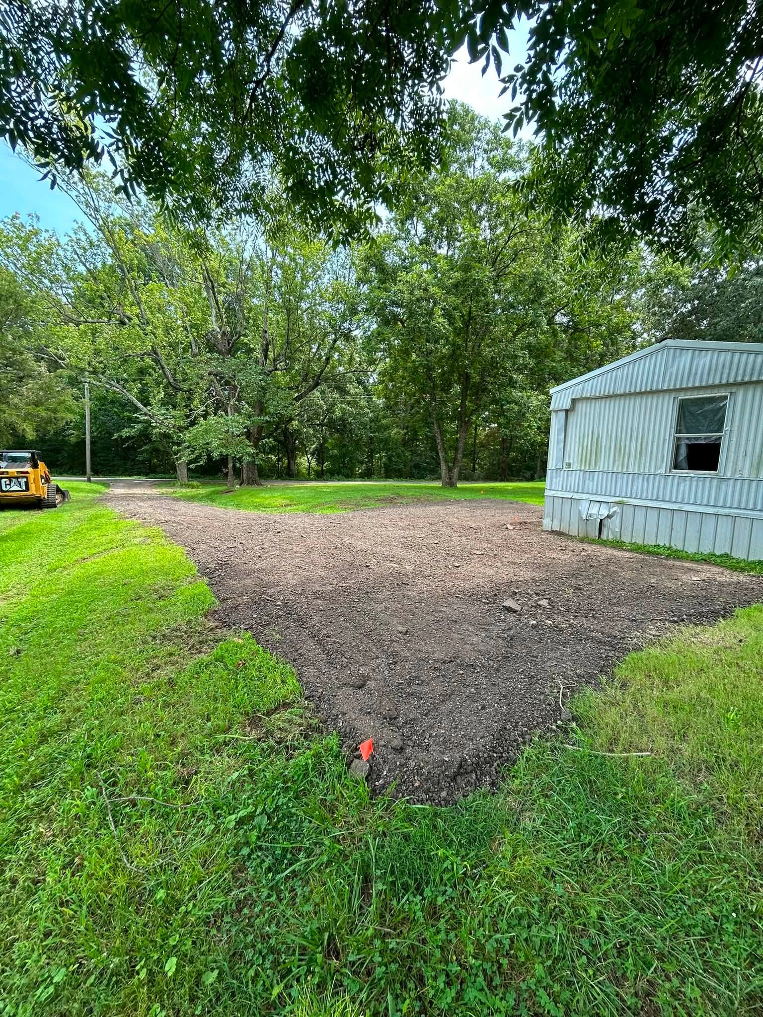 Fresh gravel turnaround beside a rural home