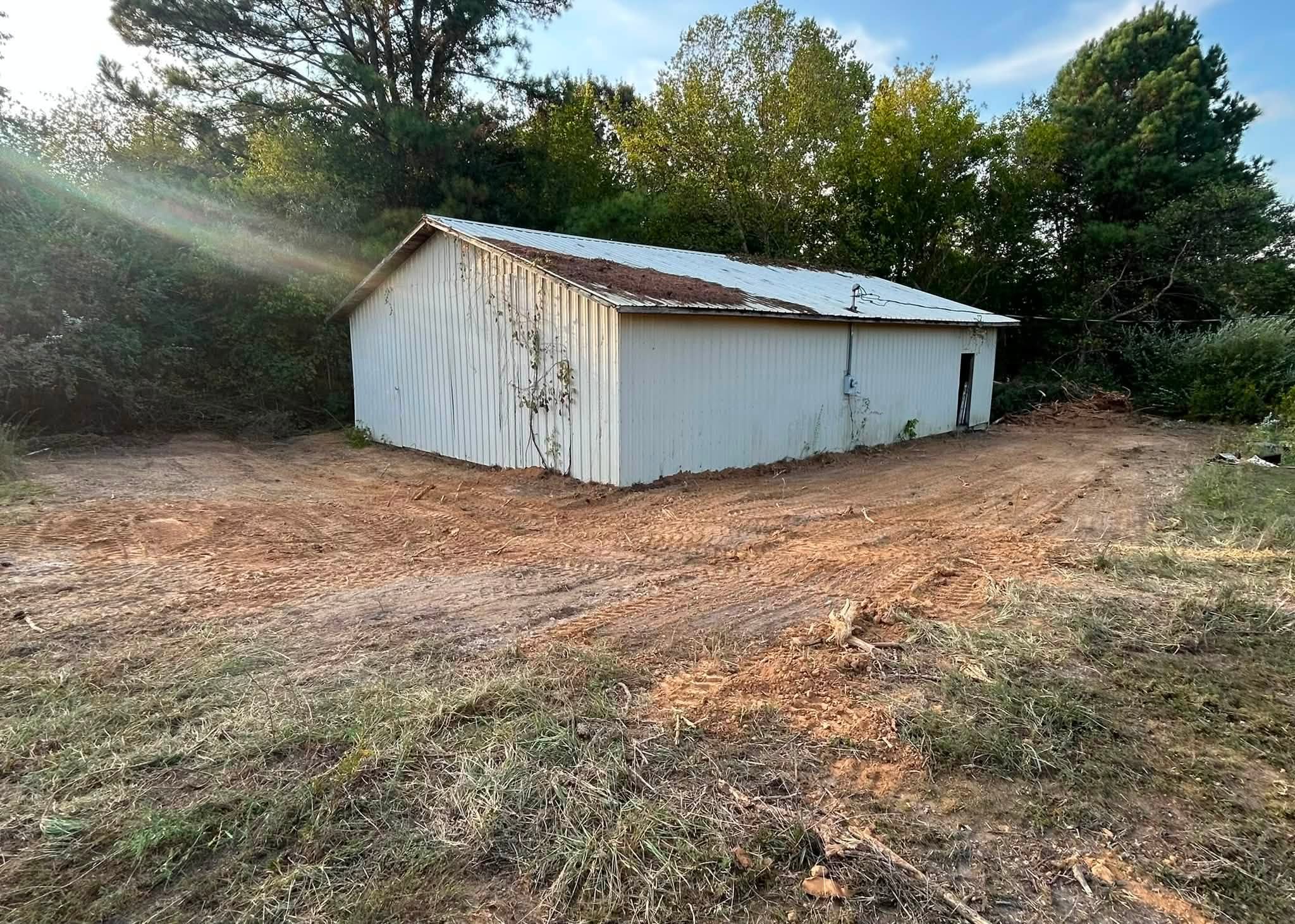 Freshly cleared ground around a rural West Tennessee workshop
